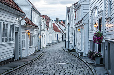 Curvy street with old nice white houses in historical center of Stavanger city, Norway -Curvy street with old nice white houses in historical center of Stavanger city, Norway -